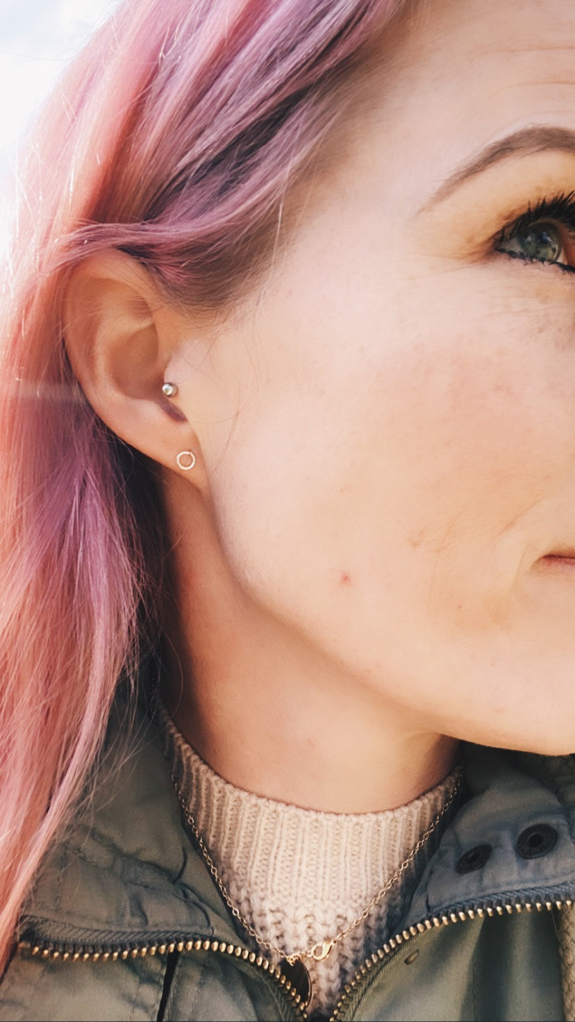 Woman wearing small circle stud